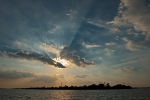 Sun rays over Mekong river island